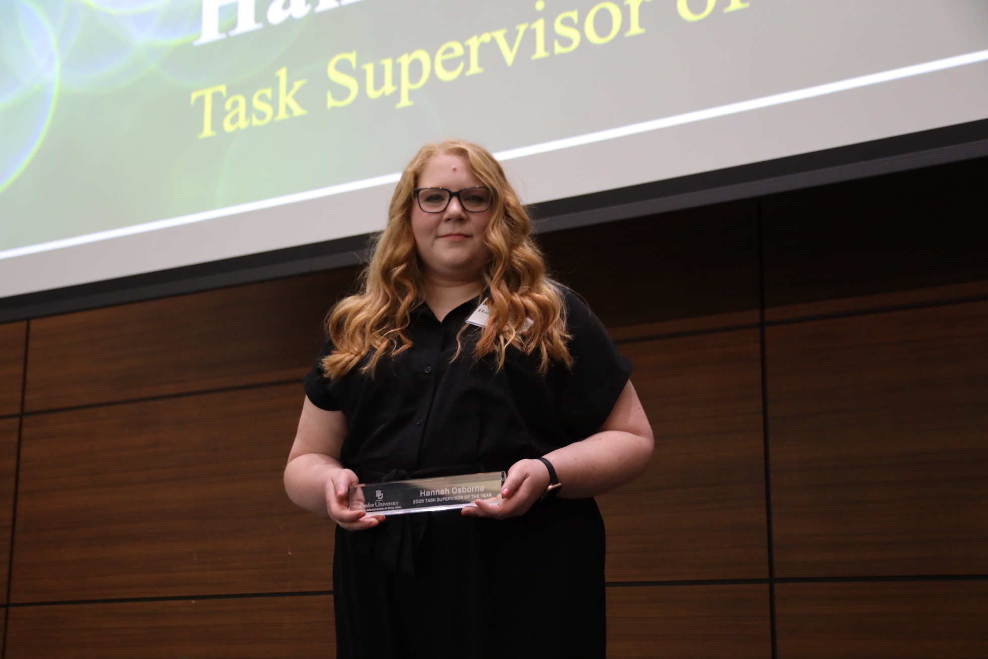 Hannah Osborne poses with her social work award