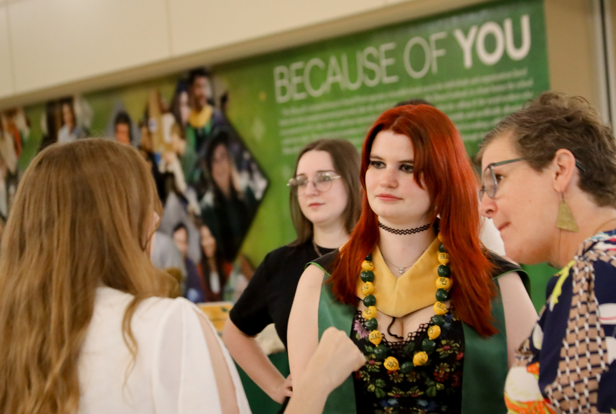 group of students and faculty chat at the reception at the garland school of social work