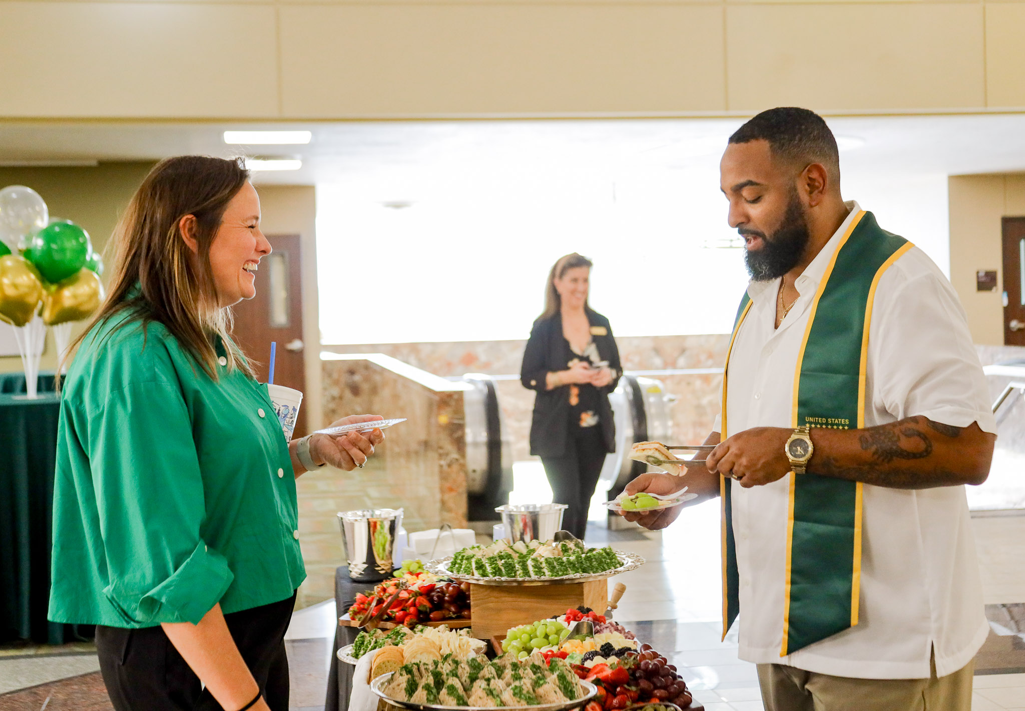 Garland Graduation Reception Social Work Alumni Talking with Faculty 