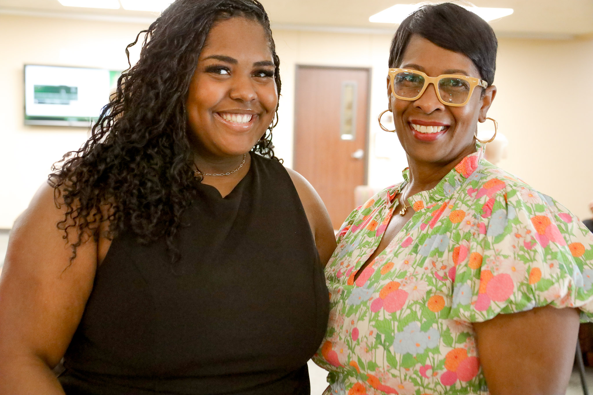 Graduate and family pose for a picture at the Baylor Social Work grad reception