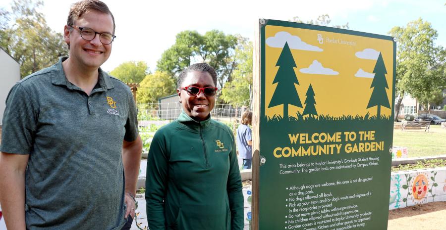 Dr. King and Dr. Boddie by the community garden sign