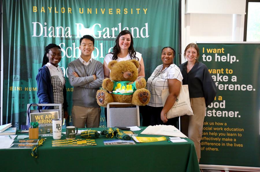 Social work students and staff pose at a conference