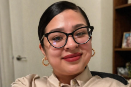 Social work award winner Antonianett Garcia smiling in a tan shirt