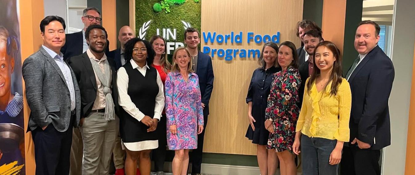 Students post in a group at the World Food Program Office